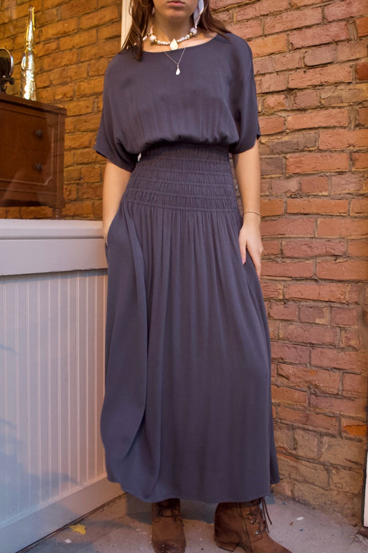 CHARCOAL LONG DRESS WITH SMOCKED WAIST AND HIGH BOAT NECK