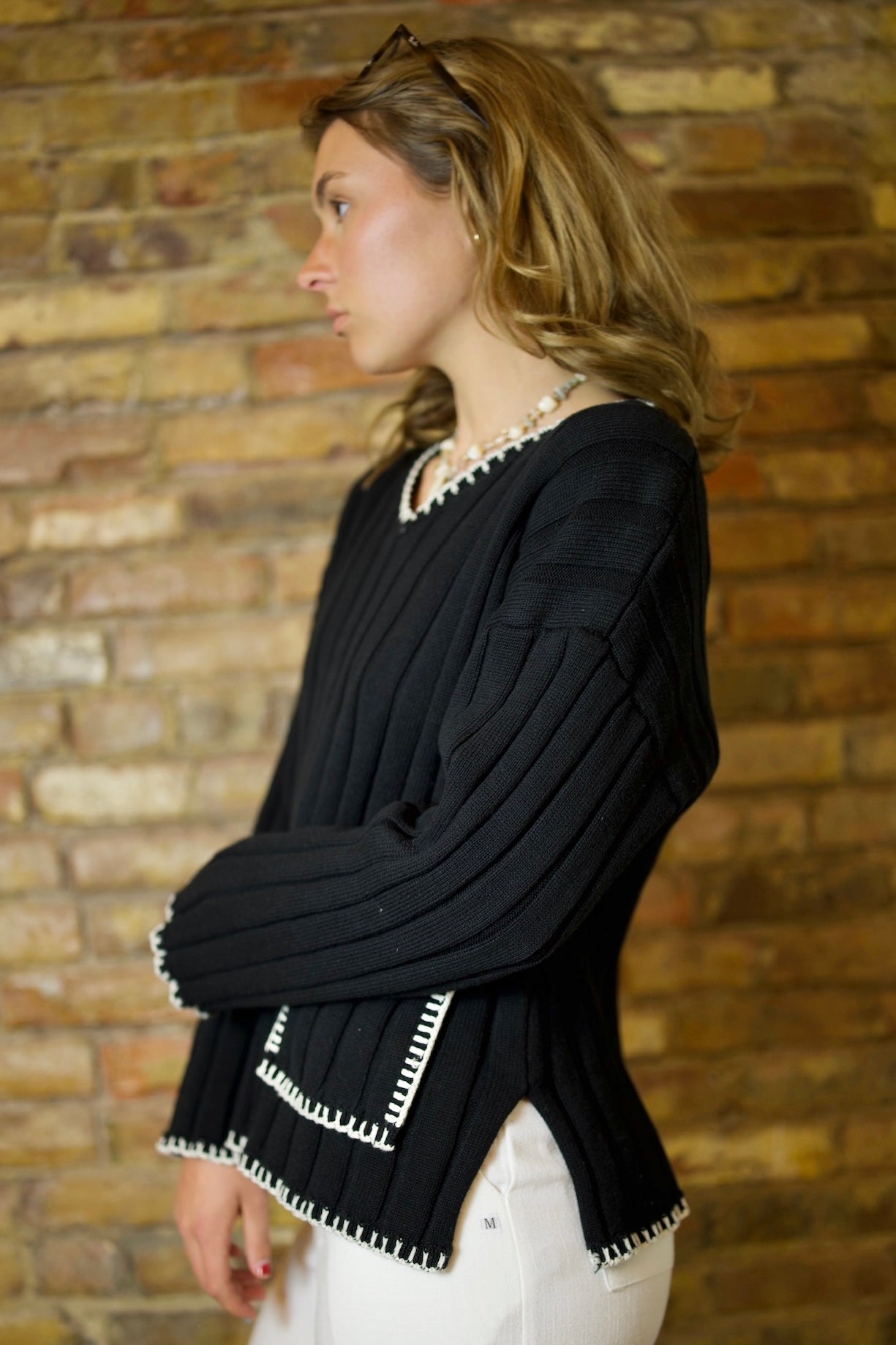 Nior White Stitching Wide Rib Sweater with nautical crochet stitching and V-neck design, showcasing chunky ribbing and oversized fit
