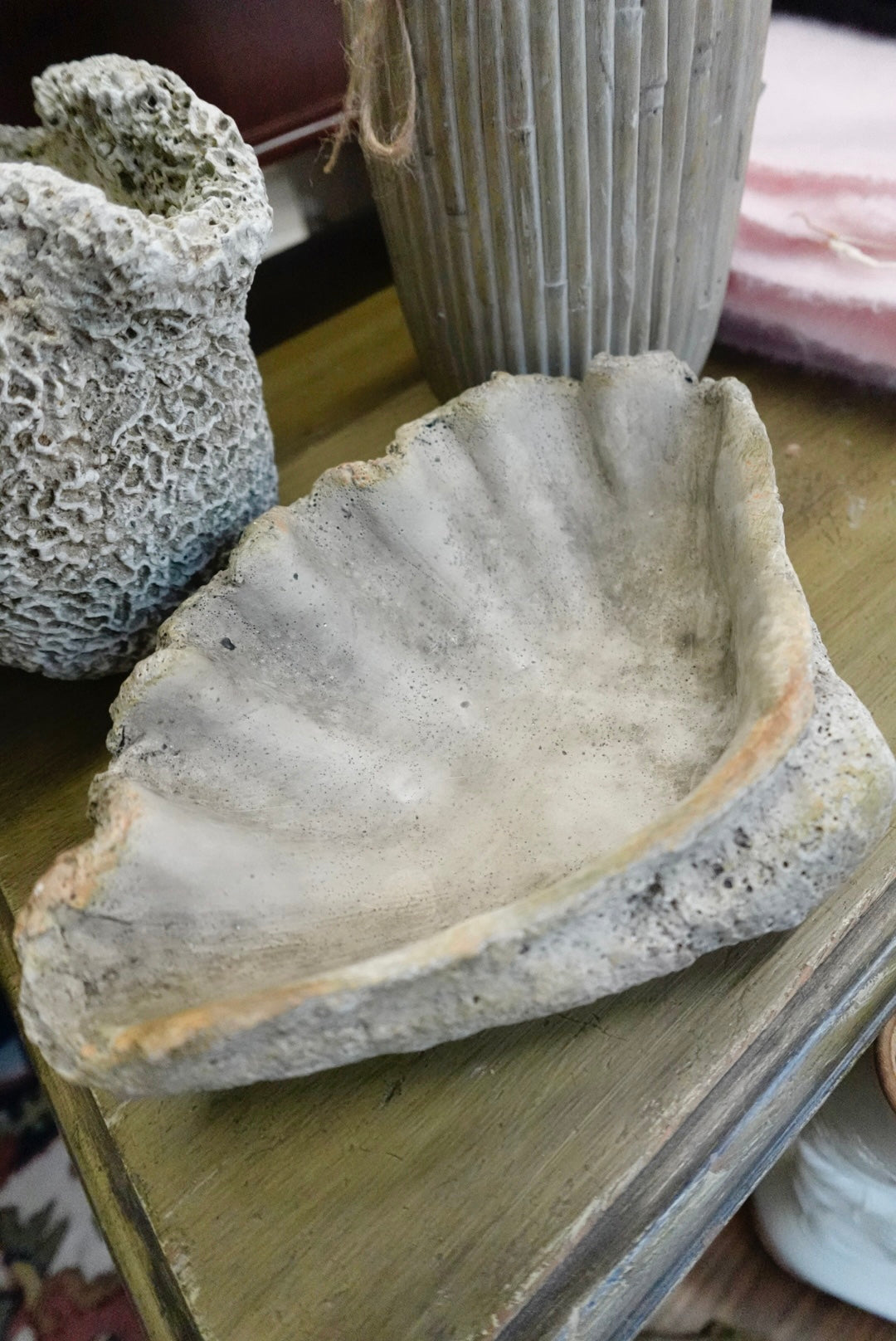 Decorative stone shelf on a wooden surface with a blurred background