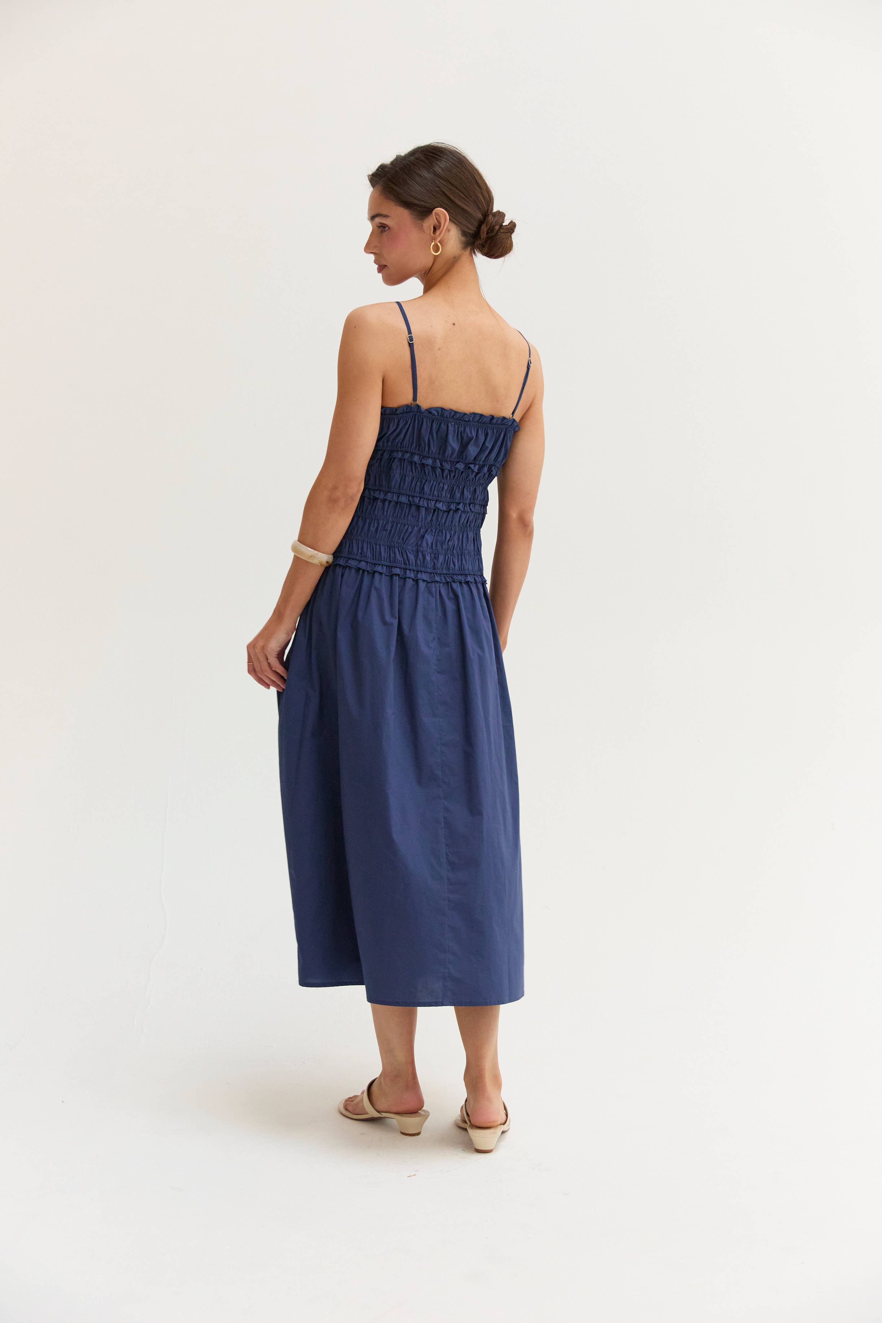 Woman wearing a blue dress on a white background