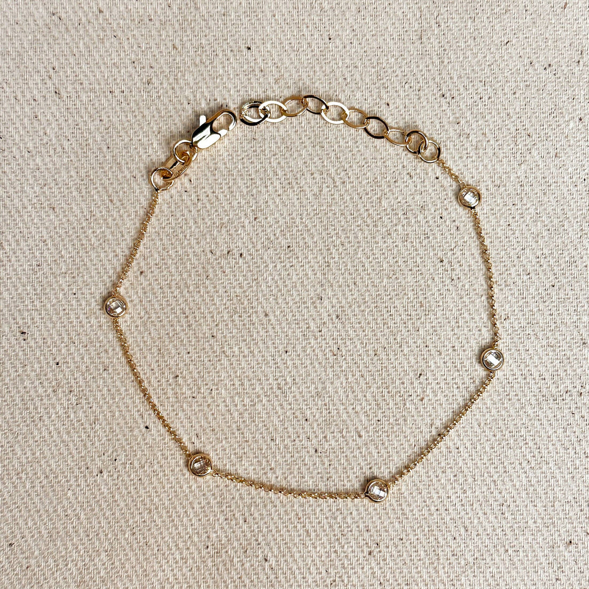 gold bezel bracelet, bezel CZ bracelet, 18k gold filled bracelet, gold filled bracelet, cubic zirconia bracelet, solitaire CZ bracelet, diamond look bracelet, dainty gold bracelet, delicate gold bracelet, minimalist gold bracelet, simple gold bracelet, everyday gold bracelet, stacking bracelet, layering bracelet, gold chain bracelet, bezel set bracelet, single stone bracelet, sparkle bracelet, adjustable gold bracelet, thin gold bracelet, classic gold bracelet, non tarnish bracelet, water resistant bracelet
