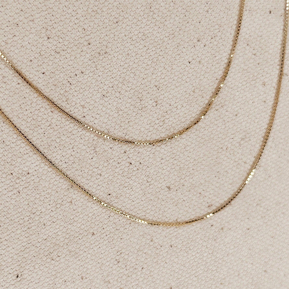 gold box chain, box chain necklace, diamond cut chain, gold filled necklace, 18k gold filled necklace, thin gold chain, dainty gold necklace, delicate gold chain, 0.5mm gold chain, simple gold necklace, everyday gold necklace, minimalist gold necklace, layering necklace, fine gold chain, gold chain for women, classic gold necklace, subtle sparkle necklace, non tarnish gold necklace, water resistant necklace, hypoallergenic necklace, nickel free necklace, affordable gold chain, 16 inch gold necklace, 18 inch