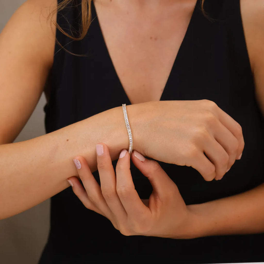 Close-up of a person wearing a bracelet on their wrist.