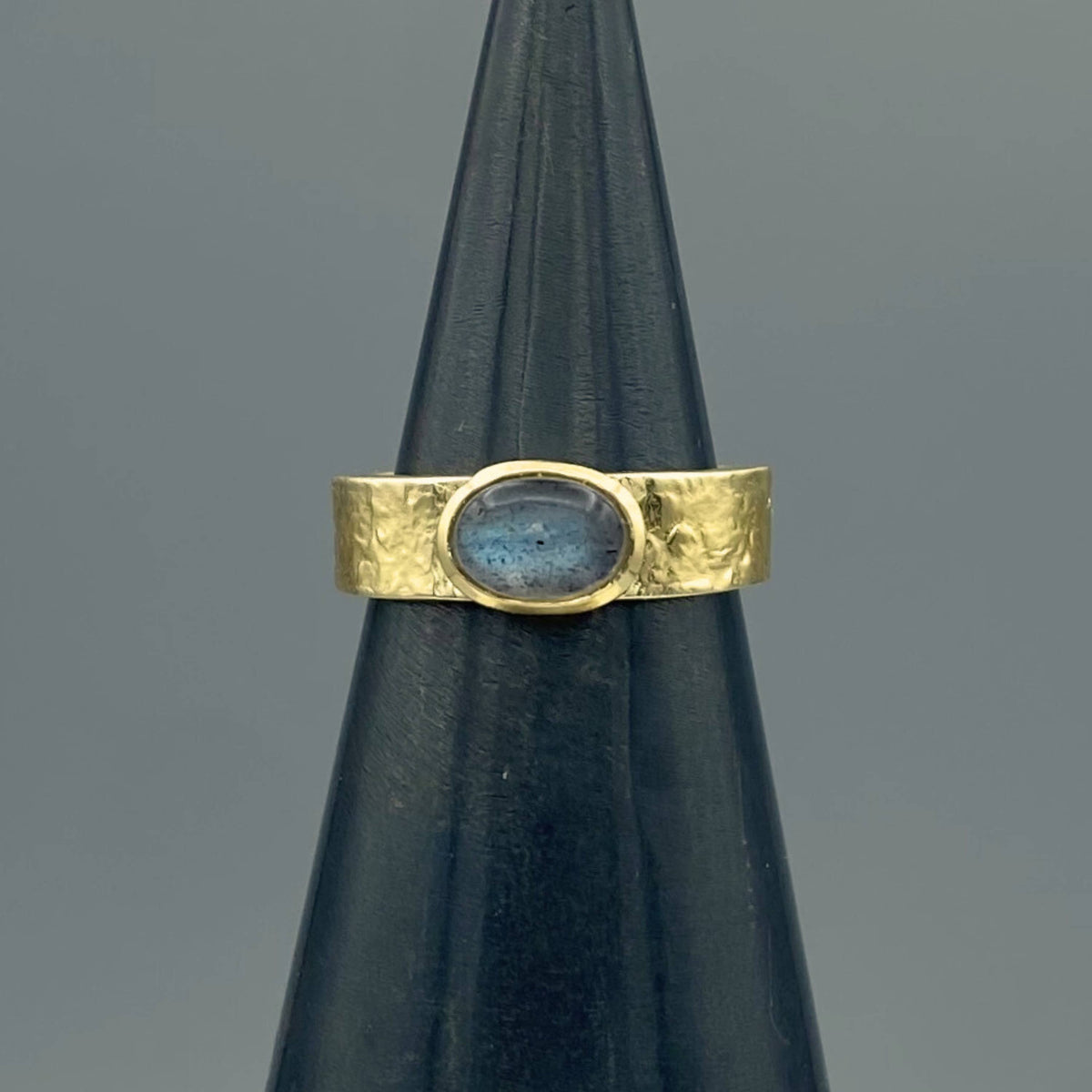 labradorite ring, gold labradorite ring, oval labradorite ring, labradorite band, textured gold band, textured band ring, gold filled ring, 14k gold filled ring, gemstone ring, natural stone ring, oval gemstone ring, cabochon ring, oval cabochon ring, bezel set ring, gold bezel ring, wide band ring, 5mm band ring, statement ring, everyday gold ring, stacking ring, labradorite jewelry, gold filled jewelry, demi fine jewelry, iridescent gemstone, gray stone ring, unique gold ring, hypoallergenic ring, nickel 