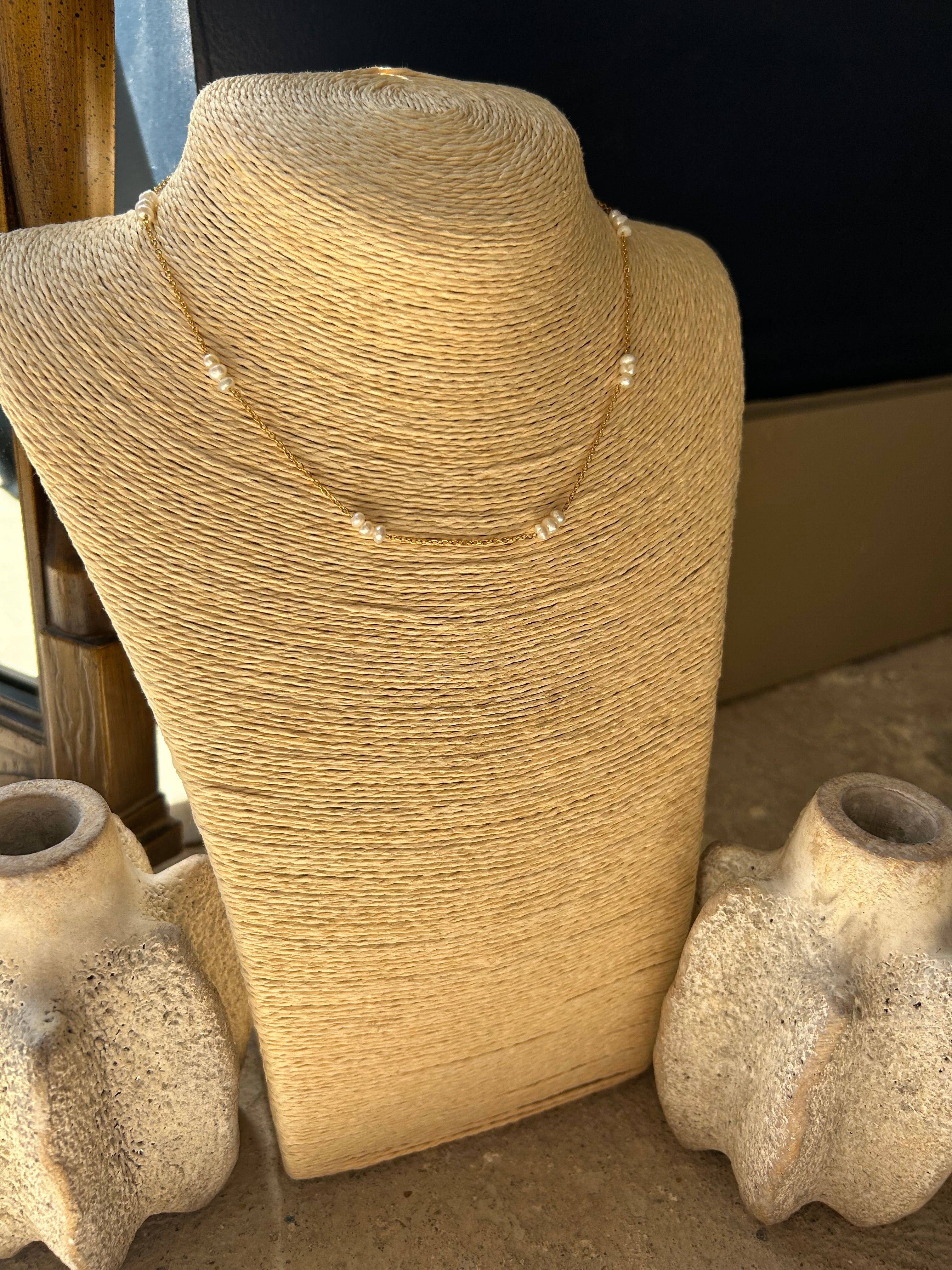 Close-up of a textured stone sculpture with a dark background