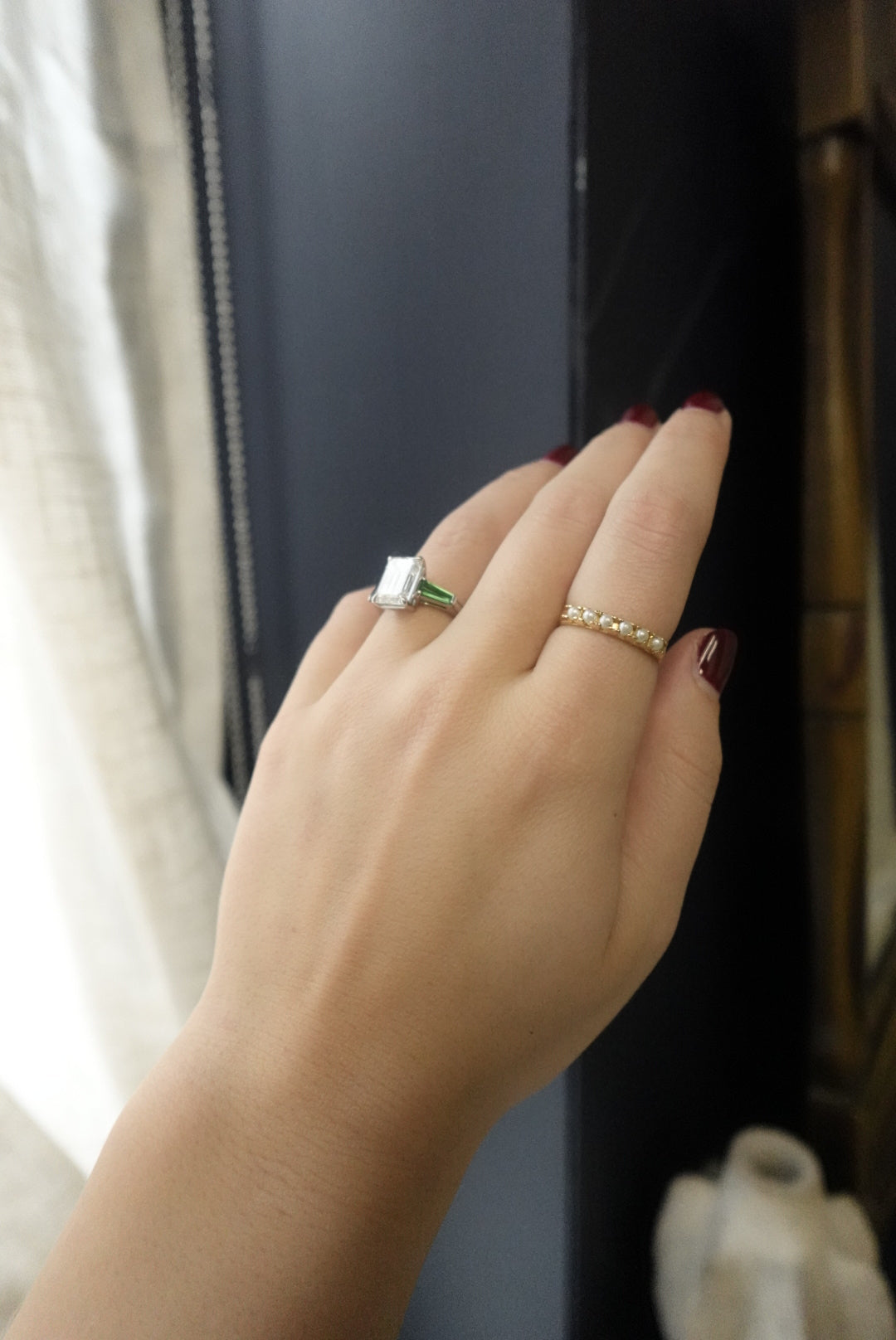 Close-up of a hand with rings on a blurred background