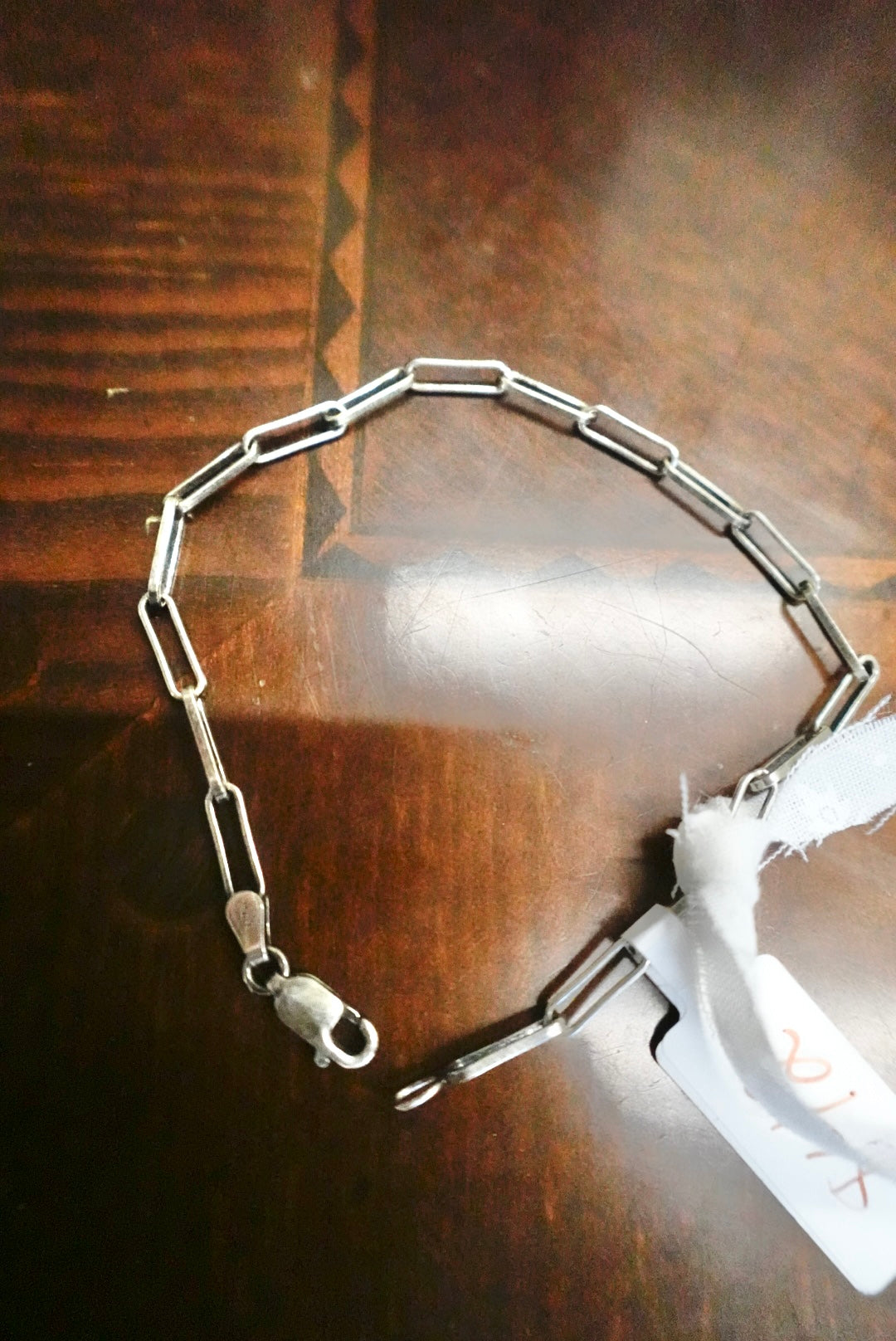 Metal chain on a wooden surface