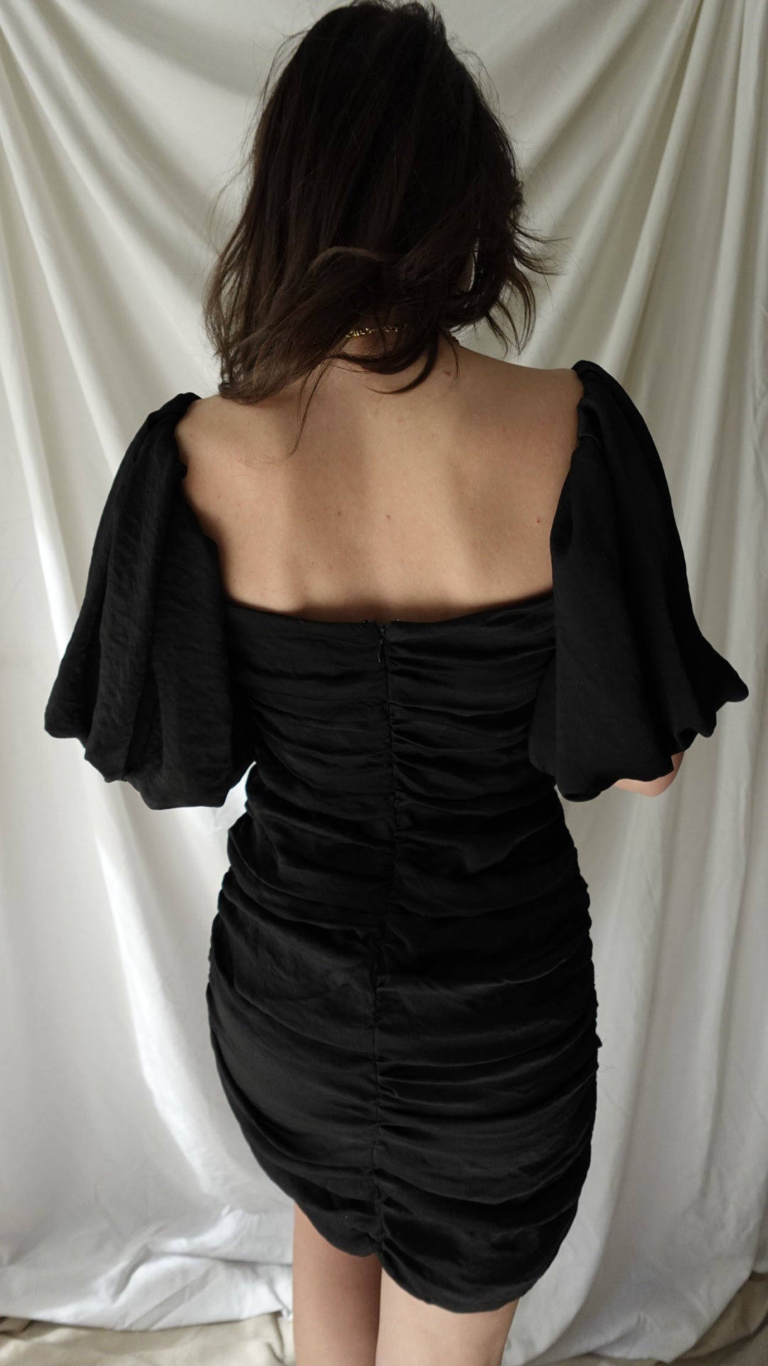 peplum black mini dress