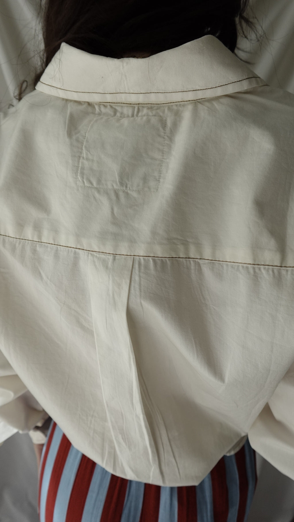 Close-up of a beige fabric with a striped background