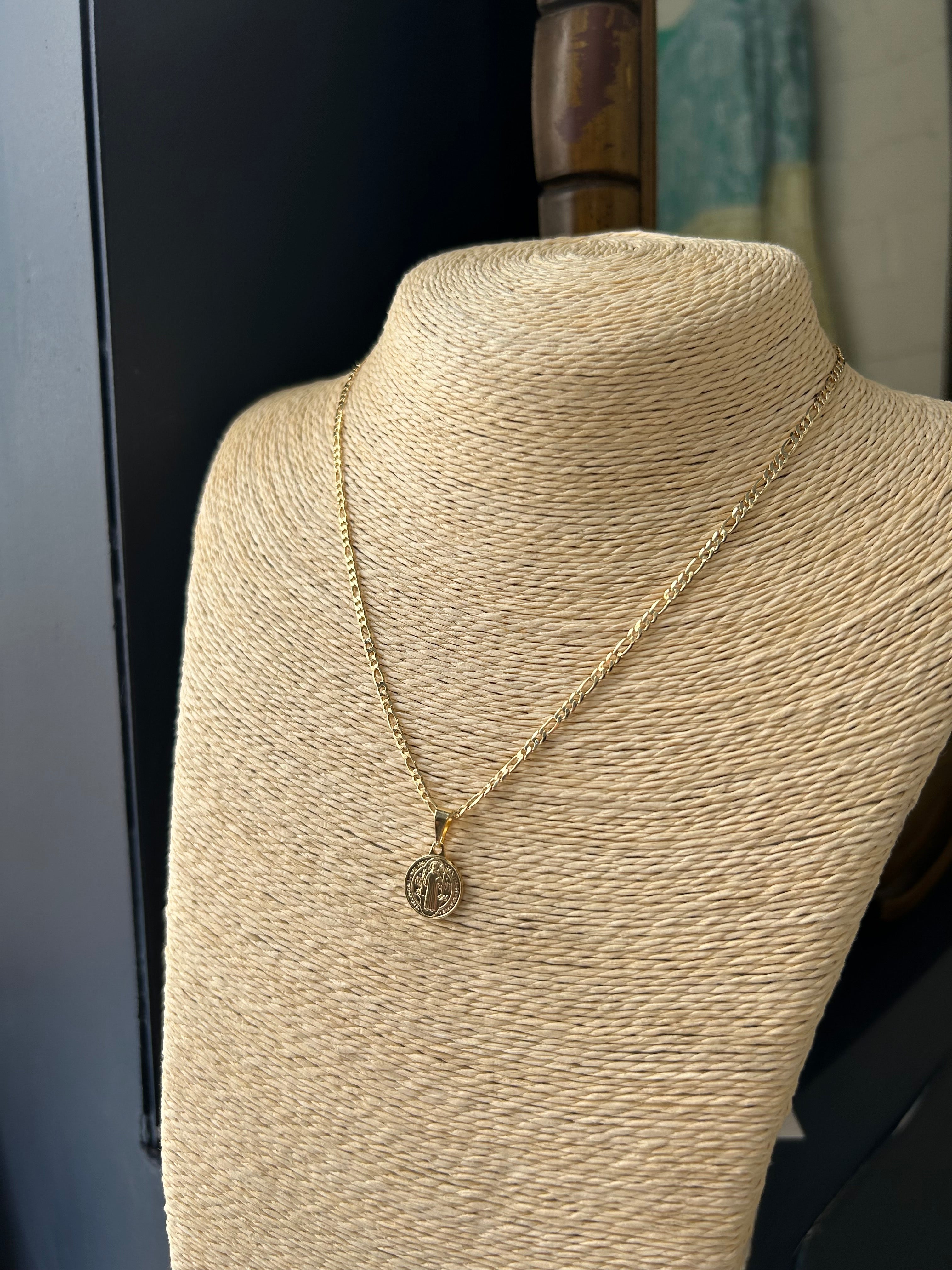 Close-up of a beige fabric with a button on a dark background