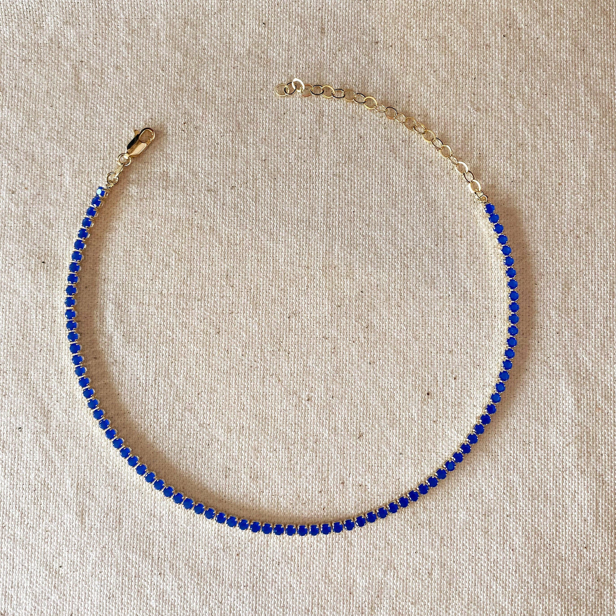 sapphire blue necklace, sapphire blue tennis necklace, sapphire CZ necklace, blue CZ tennis necklace, yellow gold necklace, yellow gold tennis necklace, gold filled necklace, 18k gold filled necklace, non tarnish necklace, affordable tennis necklace, affordable gold necklace, blue cubic zirconia necklace, sapphire look necklace, vibrant blue necklace, 3mm tennis necklace, blue choker necklace, gold choker necklace, adjustable tennis necklace, short tennis necklace, dainty tennis necklace, layering necklace,