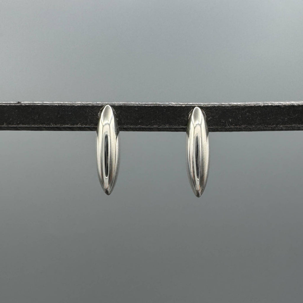 sterling silver dome studs, silver dome earrings, unique silver studs, modern silver earrings, sculptural earrings, marquise stud earrings, elongated marquise studs, elongated stud earrings, silver statement studs, minimalist silver earrings, sleek silver studs, polished silver earrings, 925 sterling silver studs, sterling silver jewelry, geometric silver earrings, oval dome earrings, curved silver studs, contemporary earrings, modern jewelry, unique stud earrings, everyday silver earrings, silver ear stack
